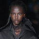 Anok Yai walks the runway at the Prada show during Milan Fashion Week Fall/Winter 2018/19 on February 22, 2018 in Milan, Italy.